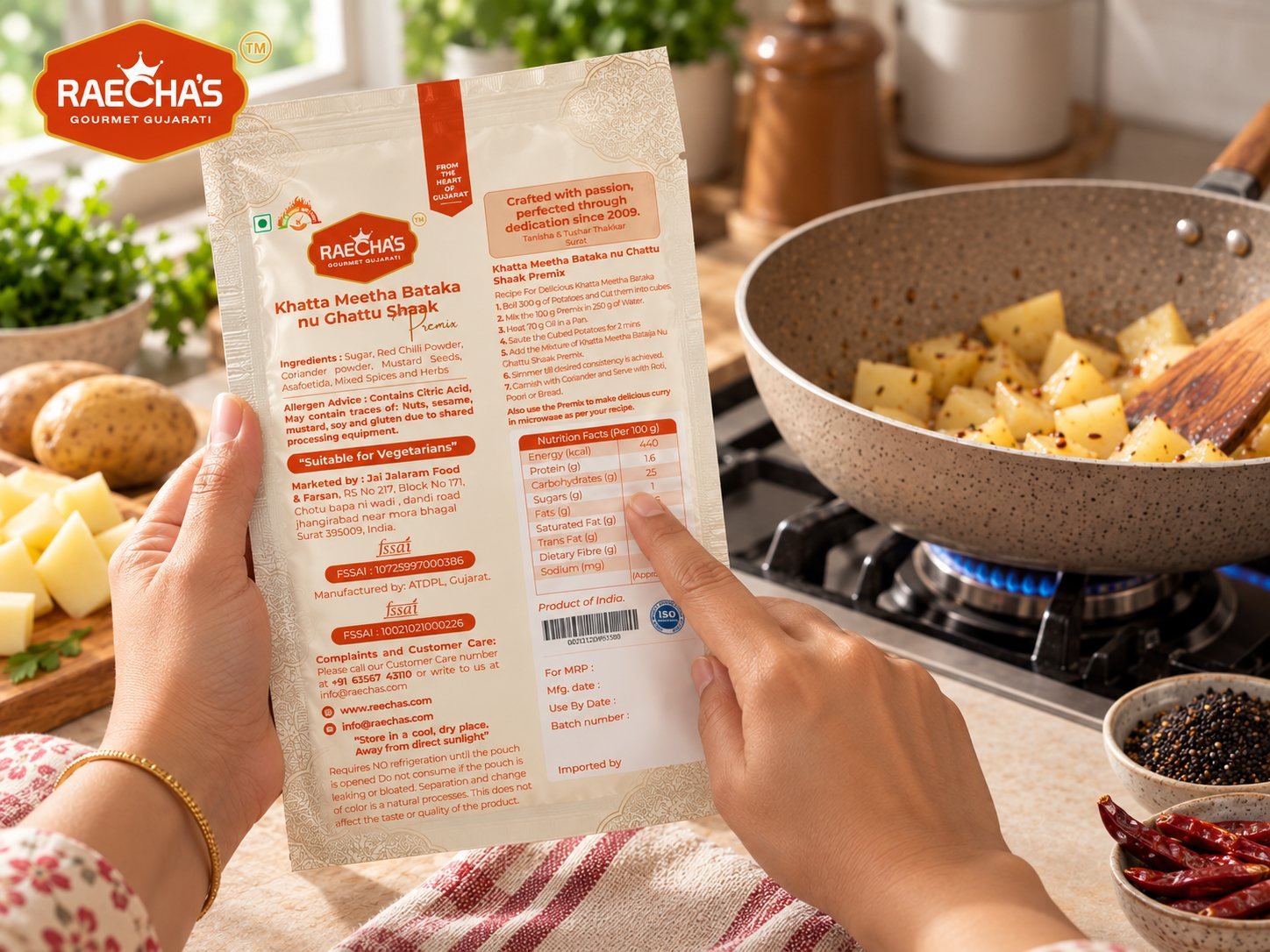 A hand reading the method printed on the back of the pouch while potato cubes cook in a pan behind it.